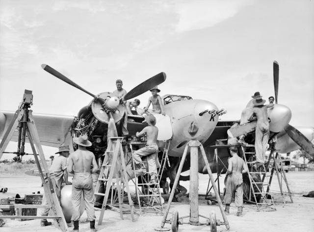 British Mosquito Aircraft Being Serviced by Crew; WWII; Labuan, Malaysia; Aug 1945