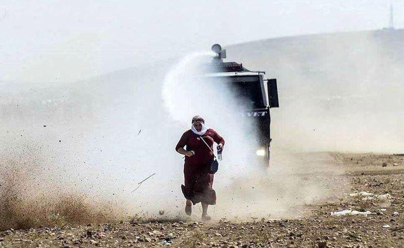 Kobane Resident Sprayed by Turkish Water Cannon, Turkey, Sept 2014