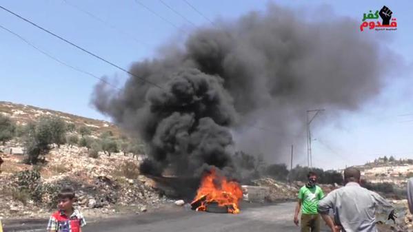 Palestinian Protesters Set Tires on Fire During Protest Against Israeli Occupation; Kafr Qadum, West