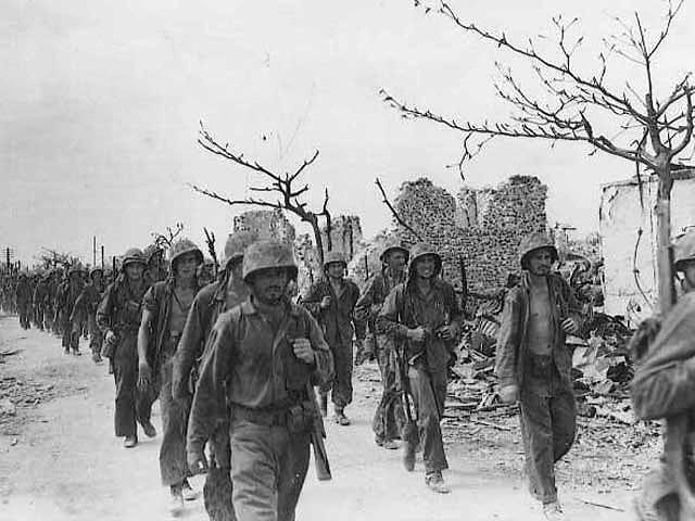 Marines March Through Garapan, Saipan, Northern Marianas, July 1944