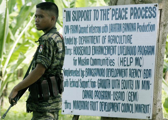 Moro Soldier Outside MILF Camp; Darapanan, Philippines, February 2008