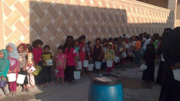 Al Raqqah Civilians in a food line, Al Raqqah Syria, August 2014