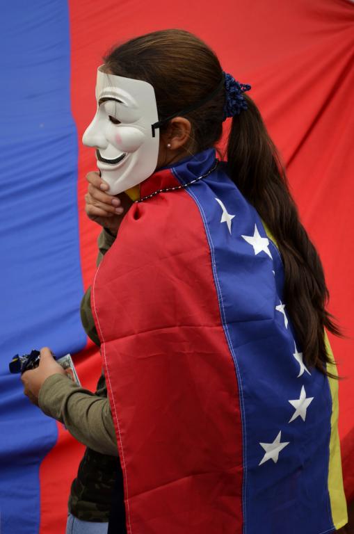 Protester in Venezuela wearing a Guy Fawkes mask;Venezuela, May 2014