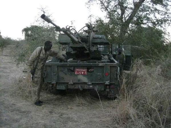 SPLM-N Soldier Poses Captured Vehicle, South Kordofan, Jan 2015