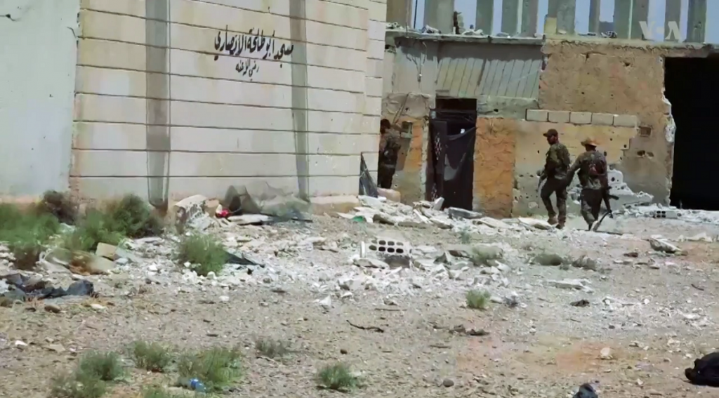 Syrian Democratic Forces Patrol Devastated Raqqa Suburb; Raqqa, Syria; June 2017