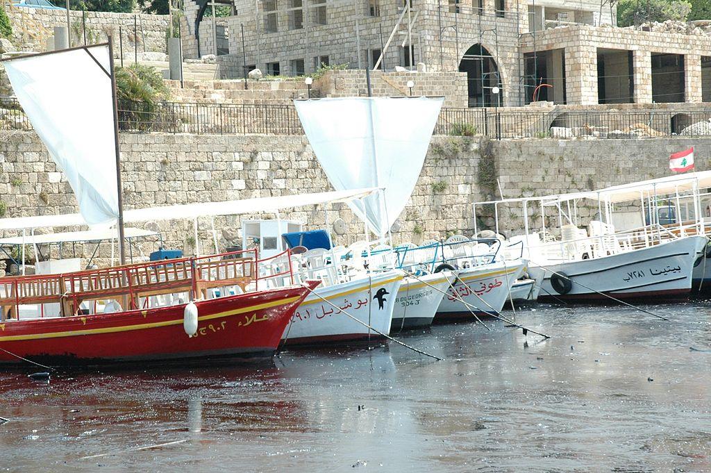 Boats in the oil-polluted harbour of Byblos