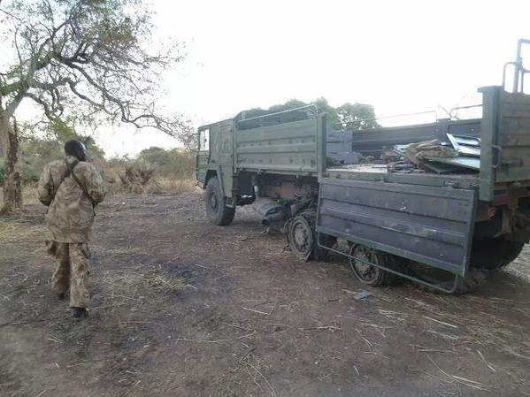 SPLM-N Soldier Walks by Abandoned Regime Truck, South Kordofan, Jan 2015