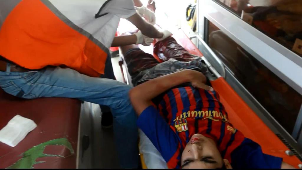 Shuja'iyaa victim in ambulance, Gaza, July 2014