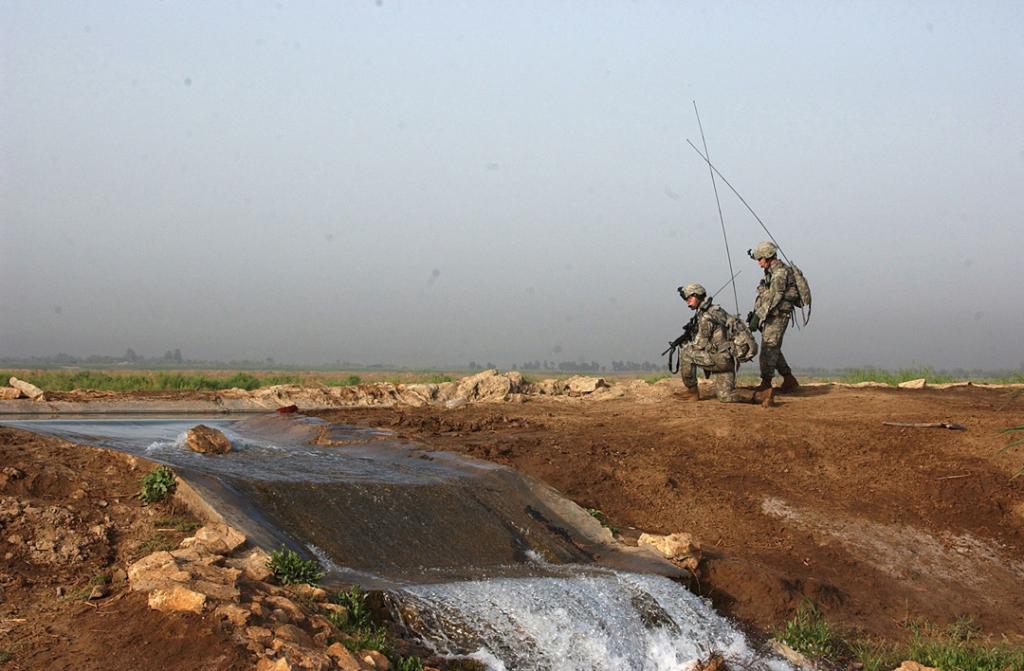 US SOLDIERS LISTEN TO RADIO TRANSMISSIONS, MAHMUDIYAH