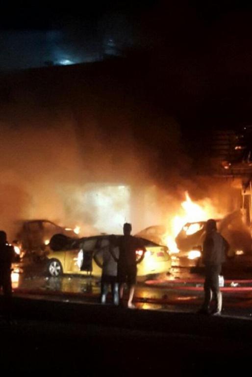 Bystanders Observe the Damage Caused by an Islamic State Car Bomb, Al-Manour Neighborhood - Baghdad 