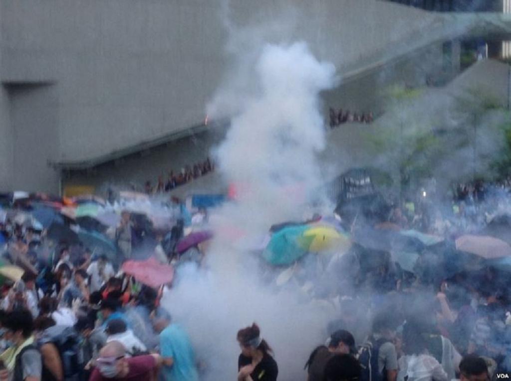 Hong Kong Protesters use Umbrellas to Shield Against Police Teargas, September 2014