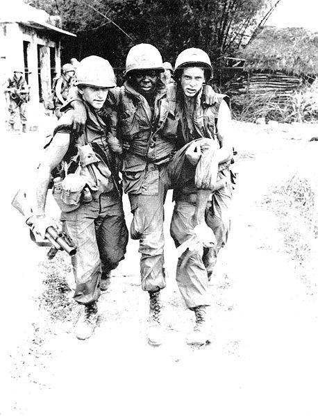 US Soldier Carried From the Field After Self-Inflicted Wound, My Lai Massacre, March 16, 1968