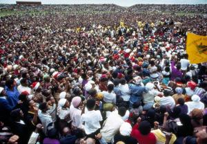 Mourners displaying a banner at at funeral ceremony for those who were killed by the South African p