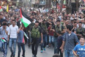 Palestinians Celebrate Raising of Flag Outside U.N. Headquarters; Nablus, Palestine, Sept 2015