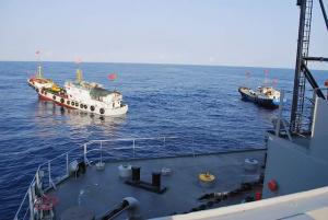 Two Chinese fishing trawlers surround the US intelligence ship Impeccable in March 2009 in the South