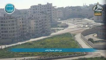 Jabhat Al Nusra Fighters Approach the Stadium Roundabout on the Outskirts of Idlib